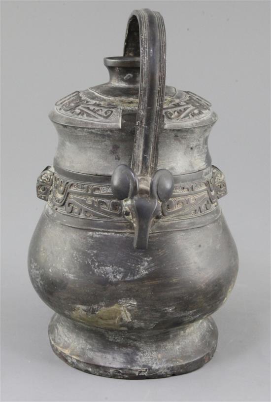 A Chinese archaic bronze ritual wine vessel and cover, You, late Shang/early Western Zhou dynasty, 11th century B.C., 22cm high, repair